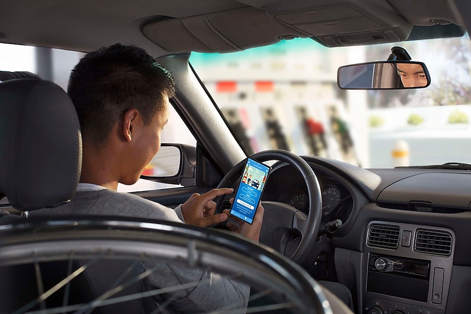 Man in car with phone